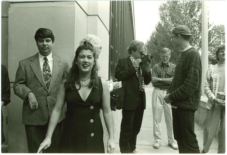 black and white pograph of several people outside