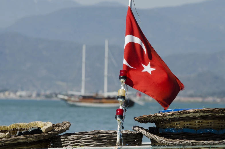 an turkish flag hanging off the end of a boat