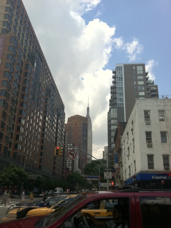 many cars and buildings in a city street