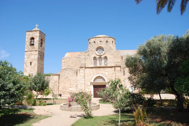 the outside view of a church with a small path running past it