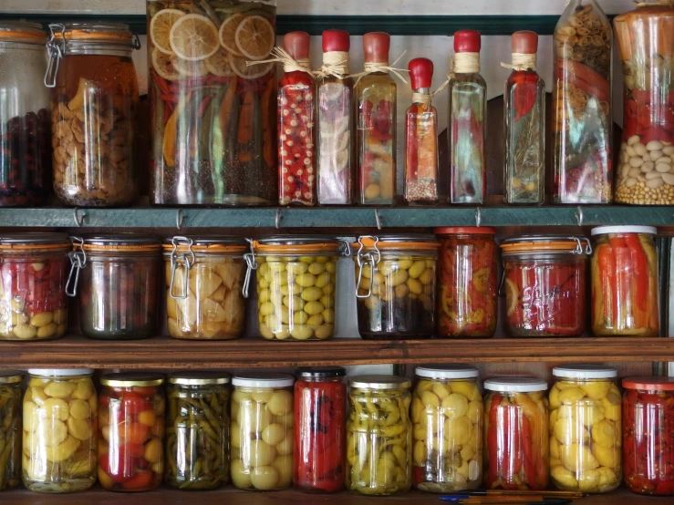 many jars and jars with different foods in them