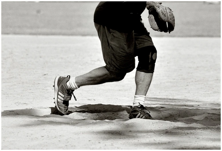 a person playing catch in a black and white po