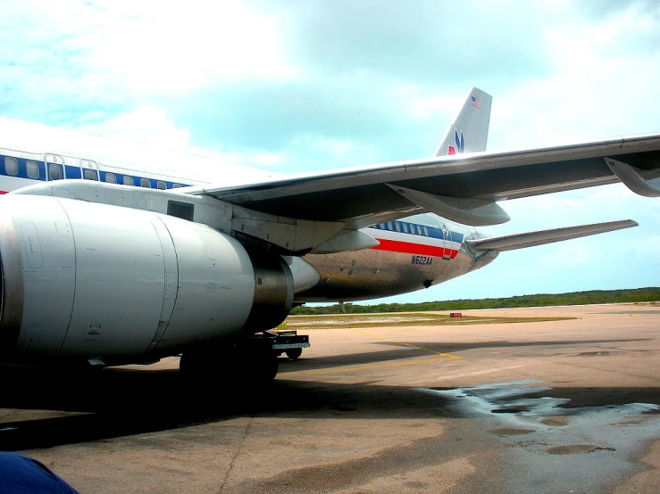 a white airplane parked in an airport