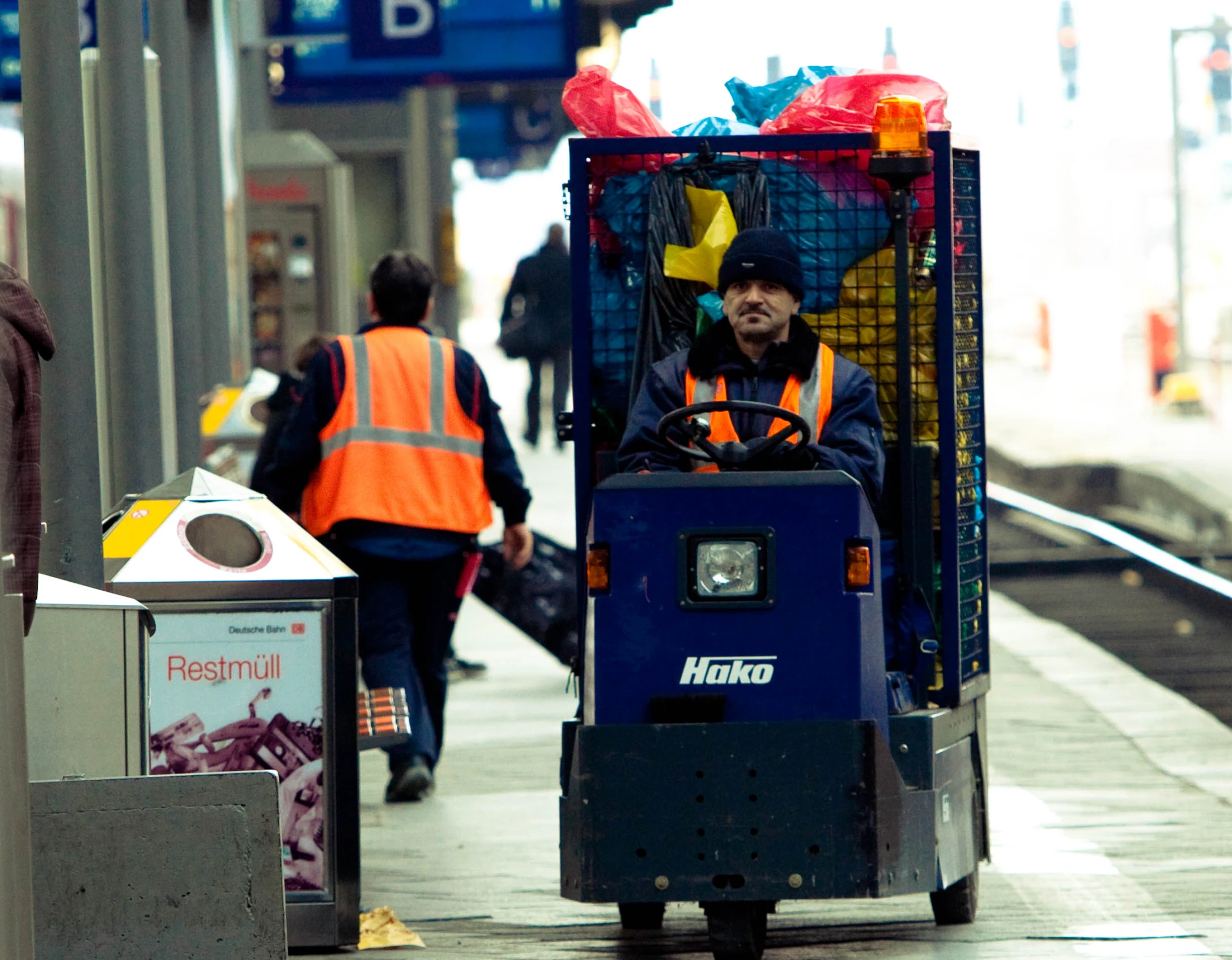 a person riding on a small vehicle down a busy city street