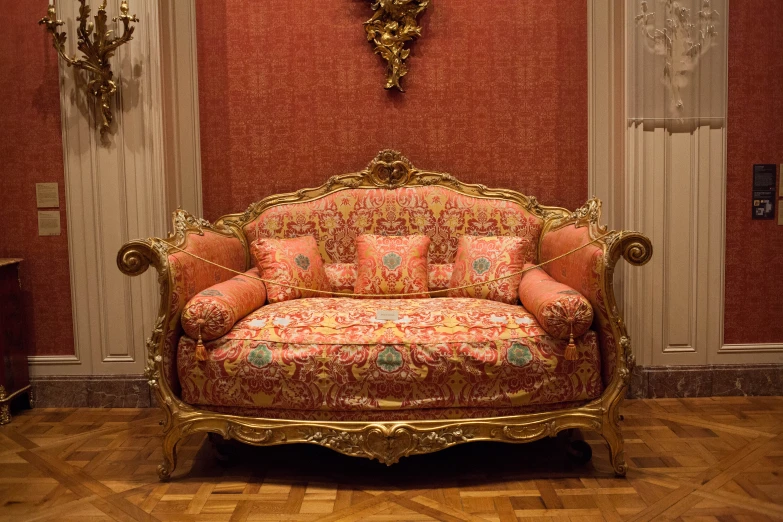 an ornate chair in an antique living room