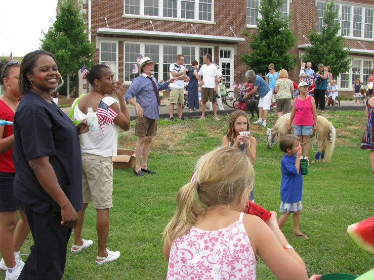 s and adults enjoying an outdoor birthday party