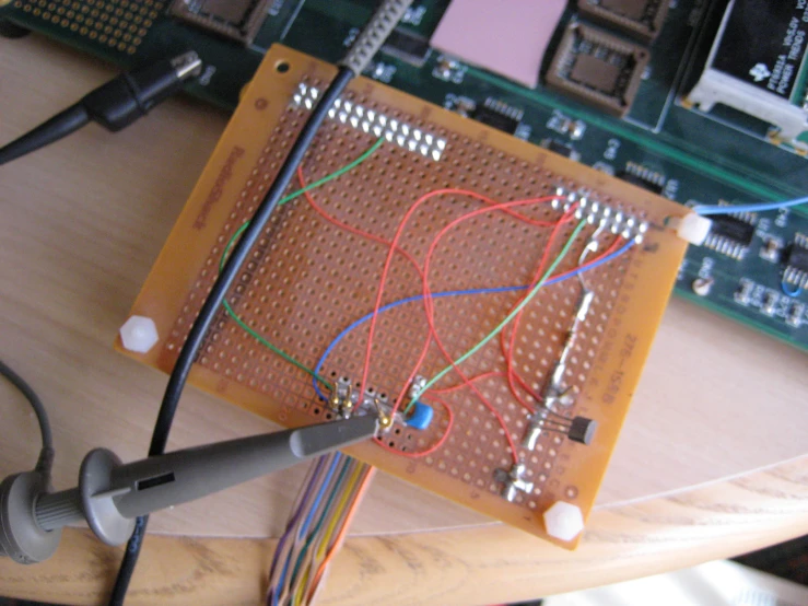 an electronic board with wires and connectors connected