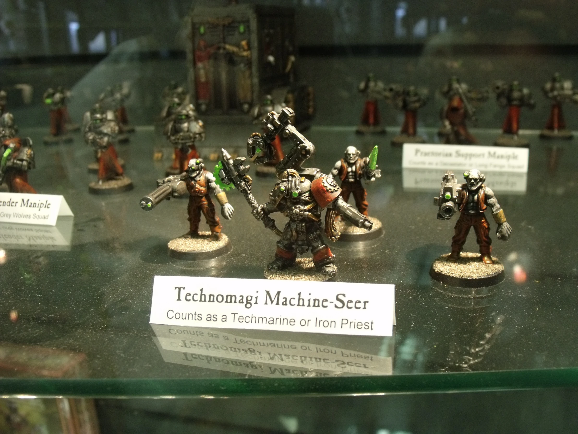 a bunch of wargames warhammers on display together