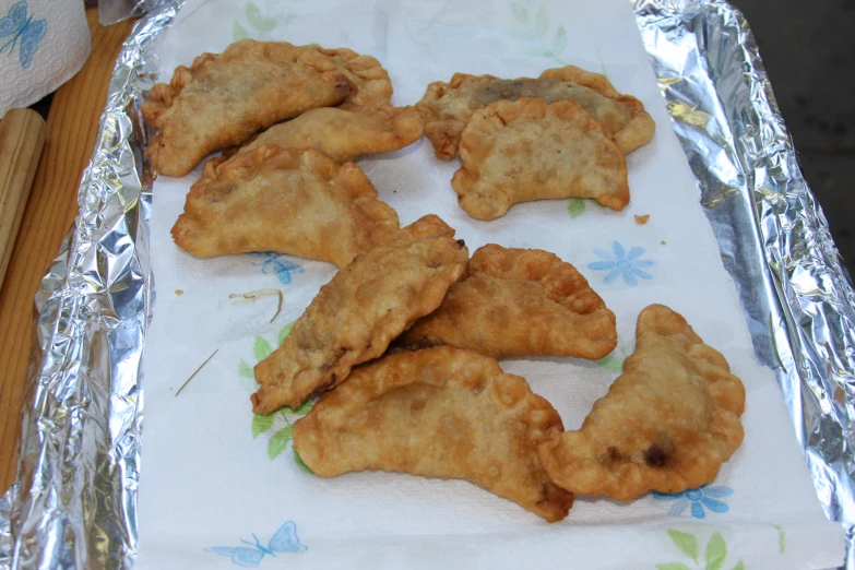 fried food on foil is on the tray