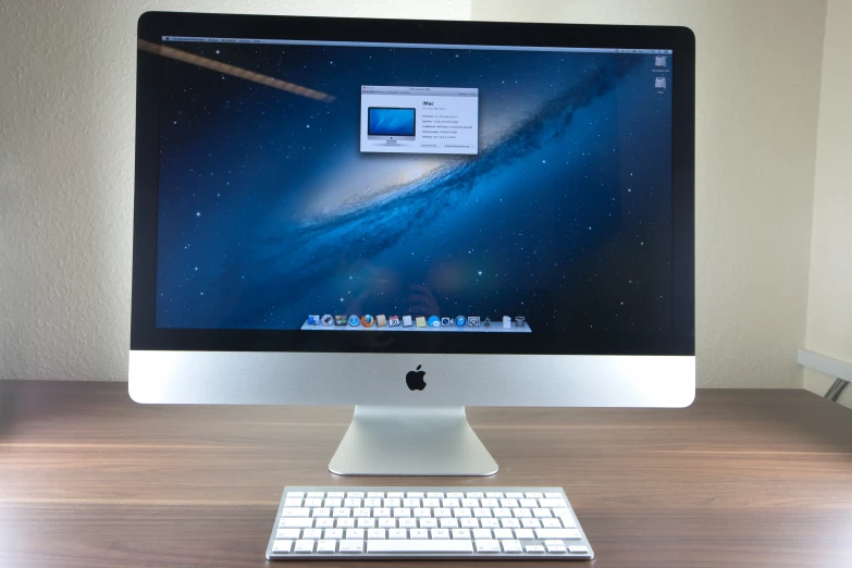 a computer monitor showing the screen of an apple desktop