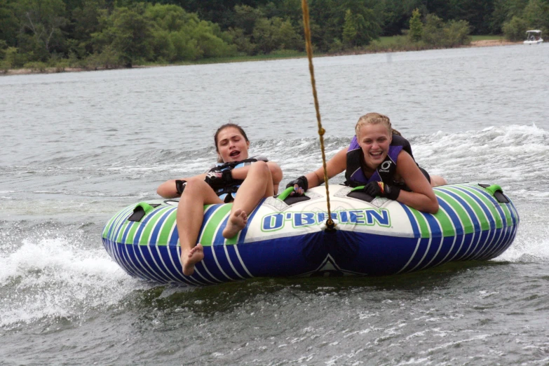 two s riding in a boat in the water