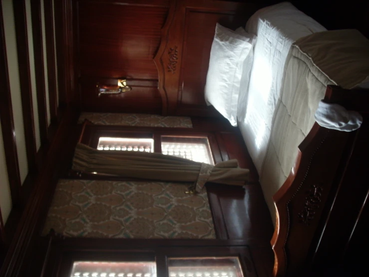 a large bed sitting inside of a wooden room