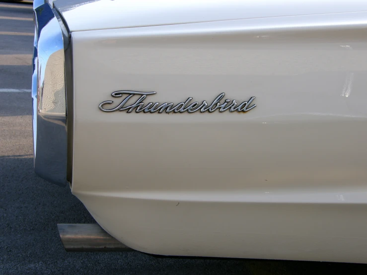 this is an old style white truck with black lettering