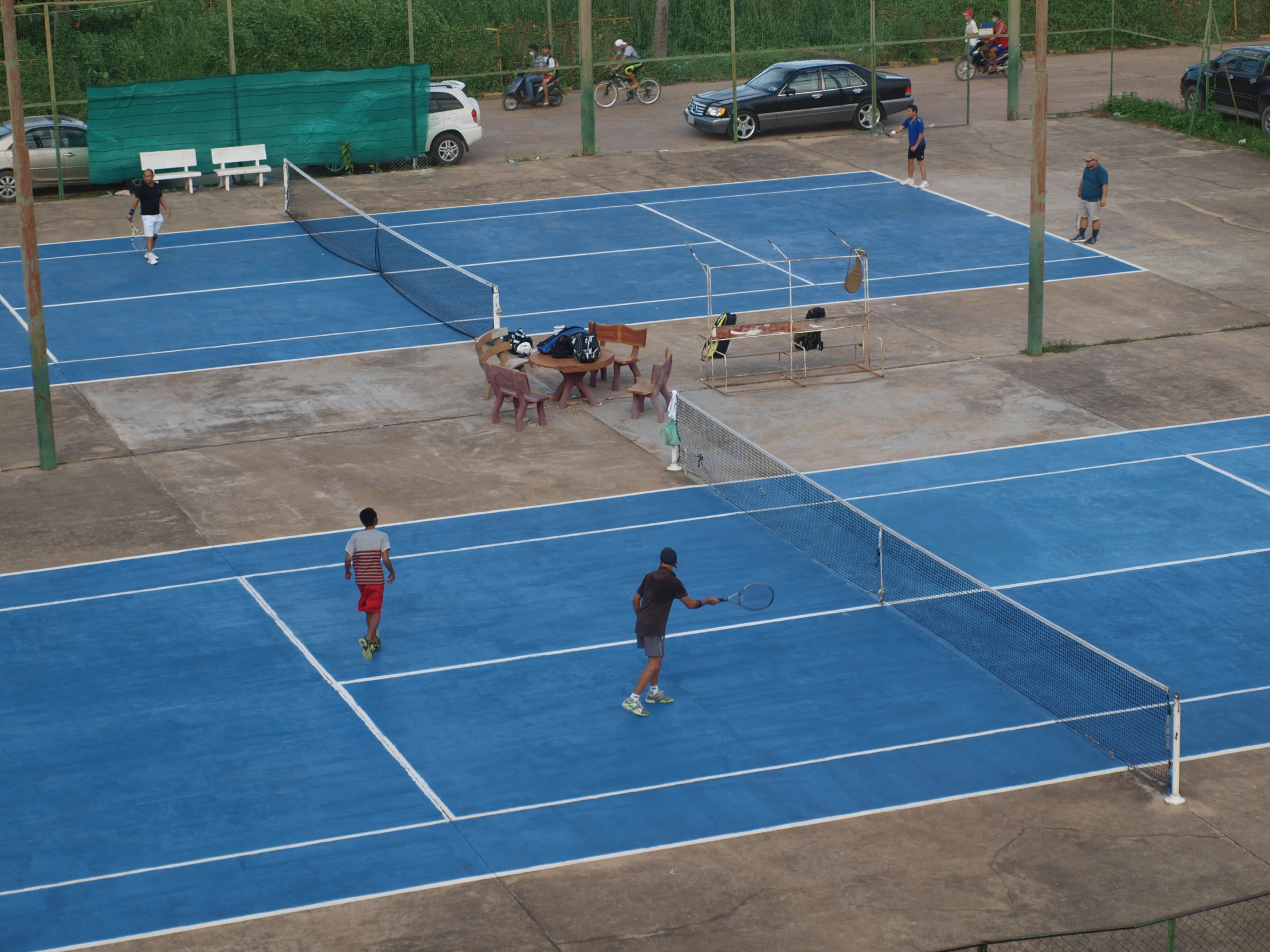 a tennis match in progress on a very big court