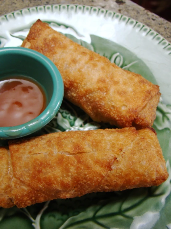 some small pastries that have dipping sauce on them