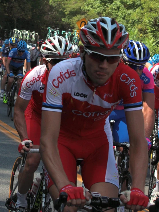 a bunch of cyclists riding in a bike race