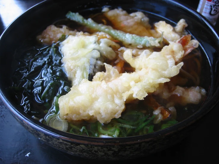 a bowl of food sitting on a table