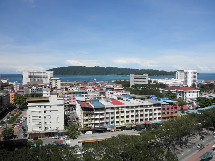 cityscape with many tall buildings near water