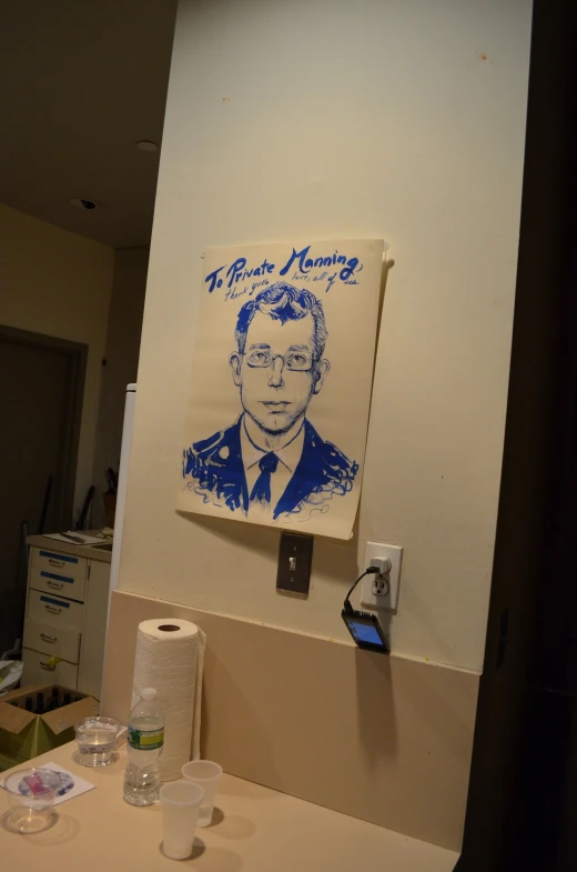 a bathroom counter with a blue and white drawing