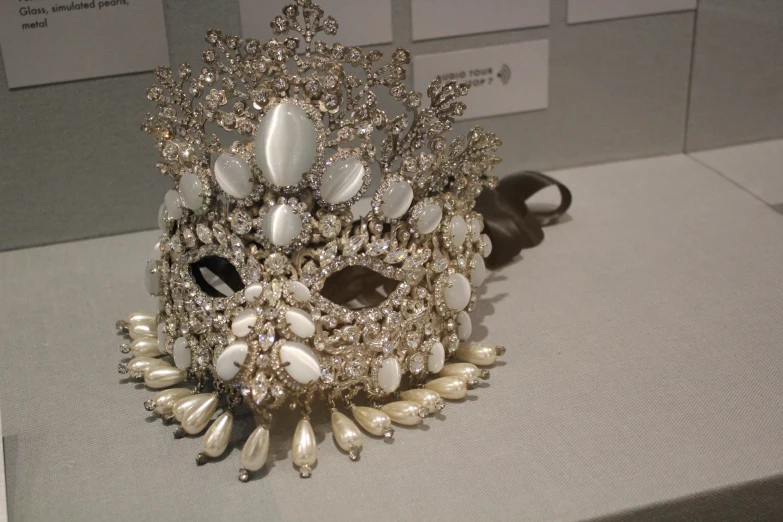 an elaborately decorated hair piece is displayed