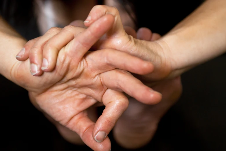 a pair of hands that are touching each other