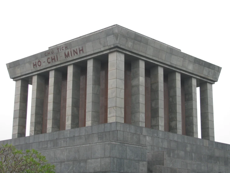 a gray concrete monument with three red lines