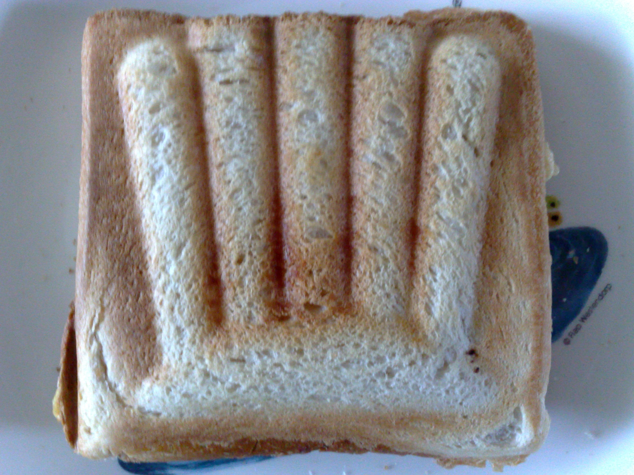 a piece of toast sitting on top of a white plate