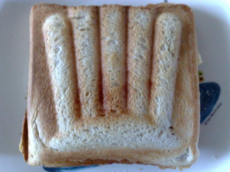 a piece of toast sitting on top of a white plate