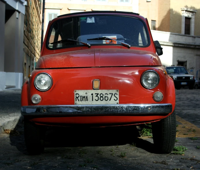 a close up of the front bumper and headlights on an older car