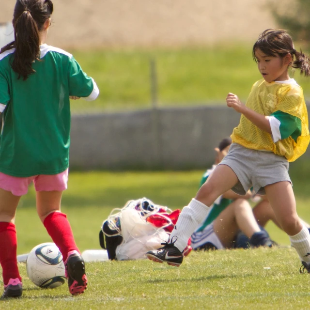 the s are playing soccer in their uniform