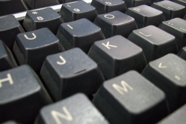 a close up of a computer keyboard with a numeral keyboard