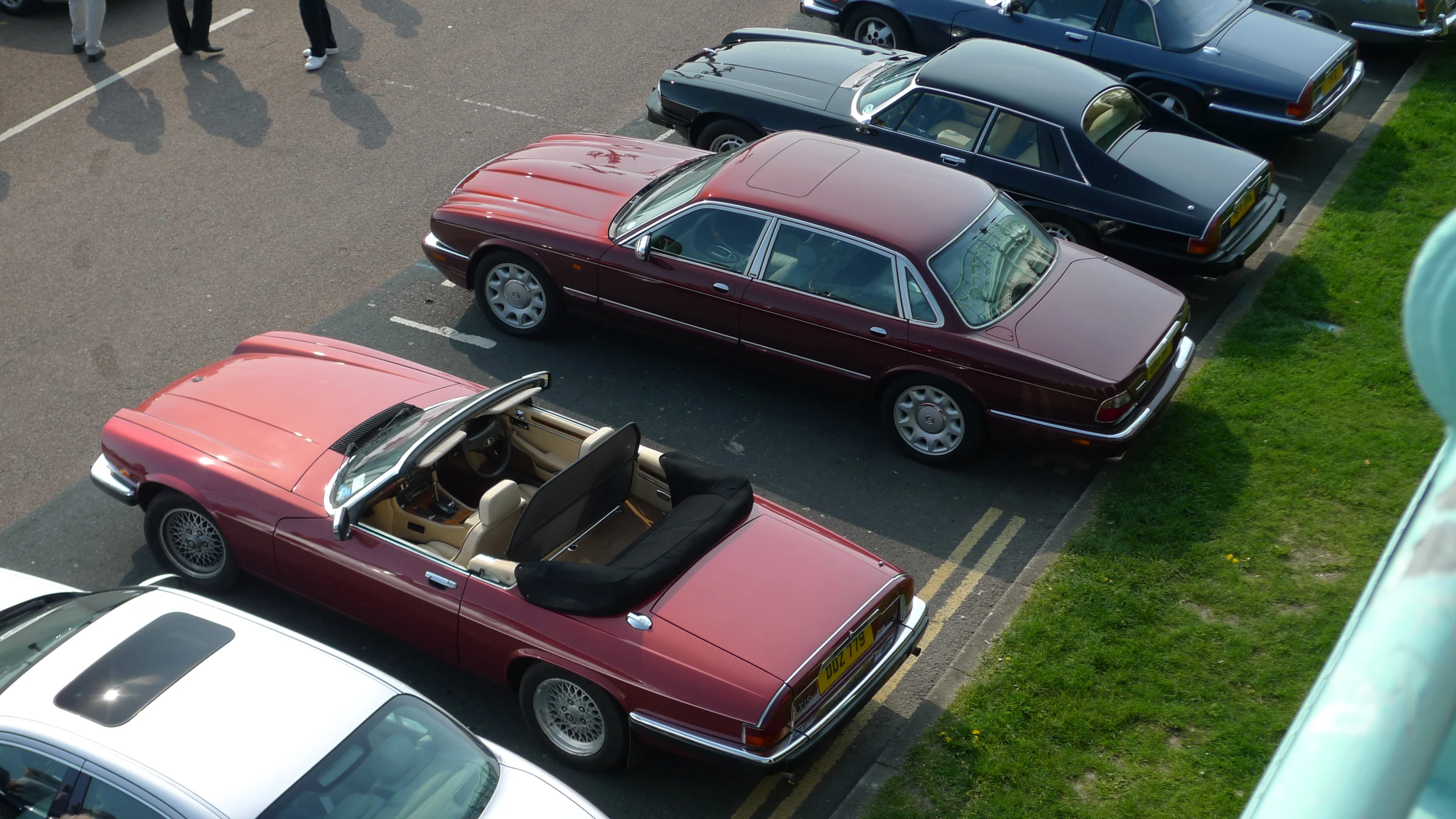 several different cars parked together in the lot