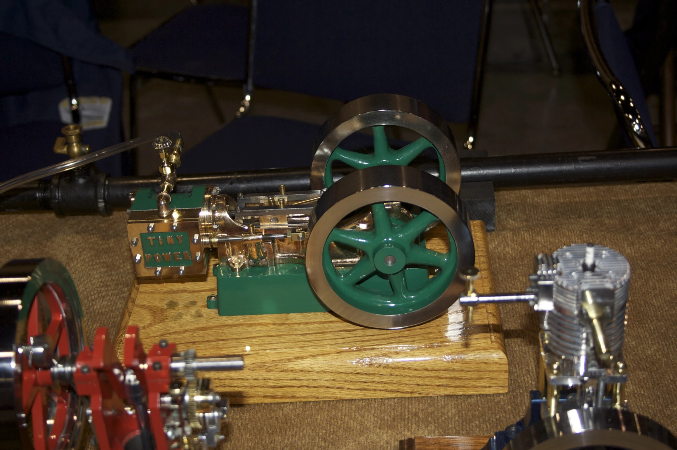 a machine with gears attached on a wooden table