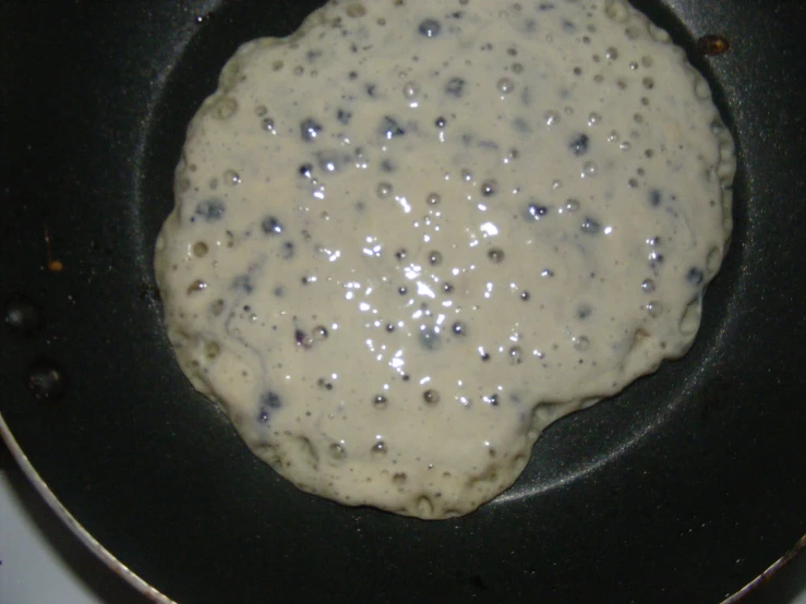 a close up of a food in a pan on a stove