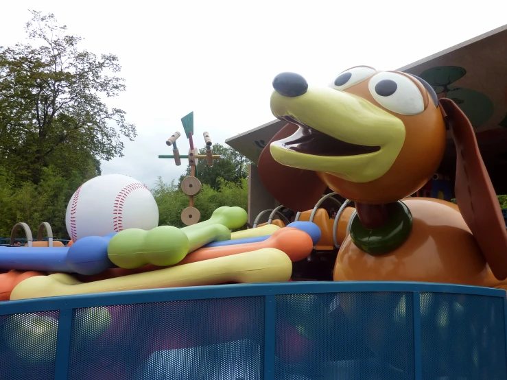 a dog in the mouth of a ride at a carnival