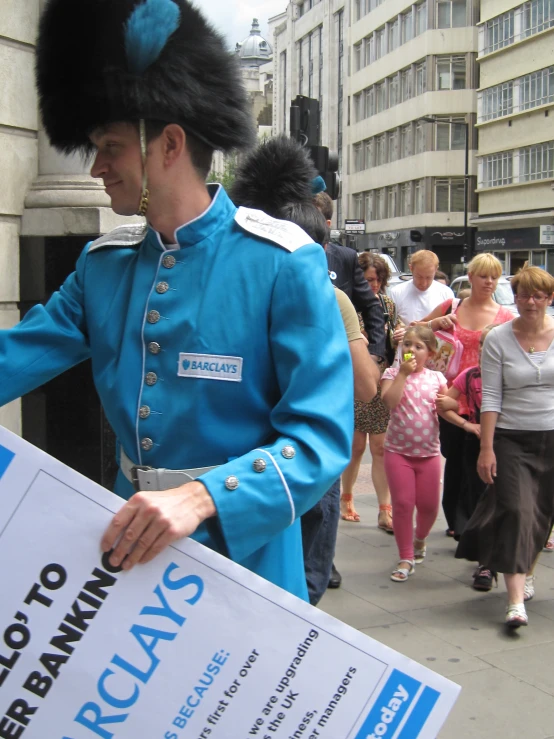 a man is dressed in an old royal uniform