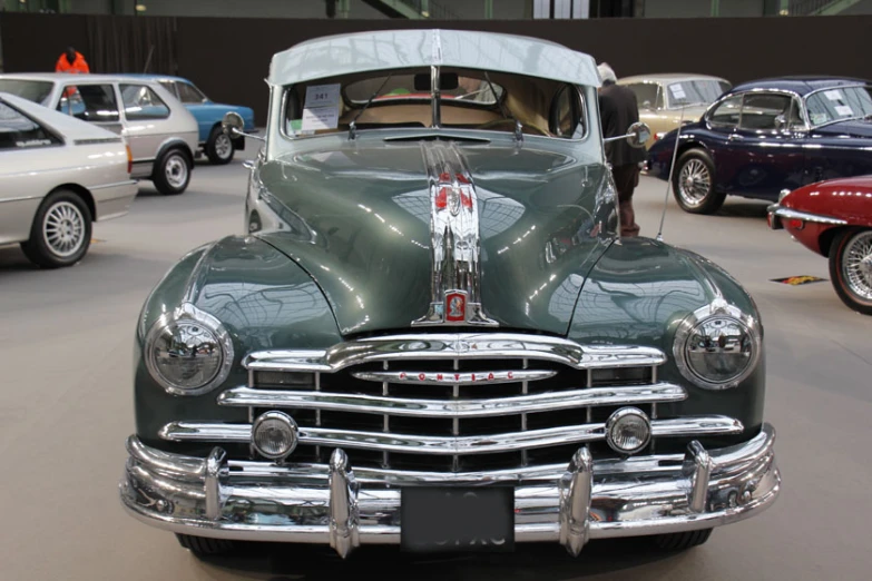 there is an old classic car parked at a show