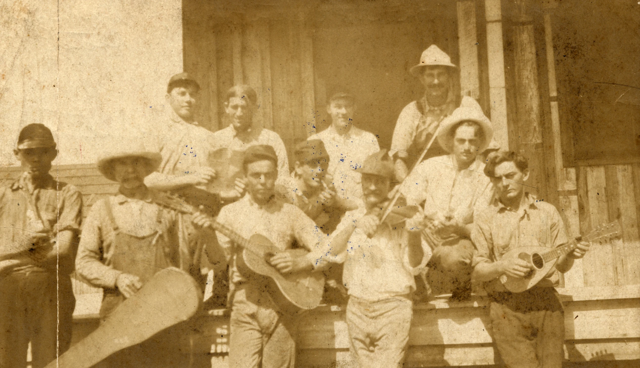 an old po shows a group of men with guitars