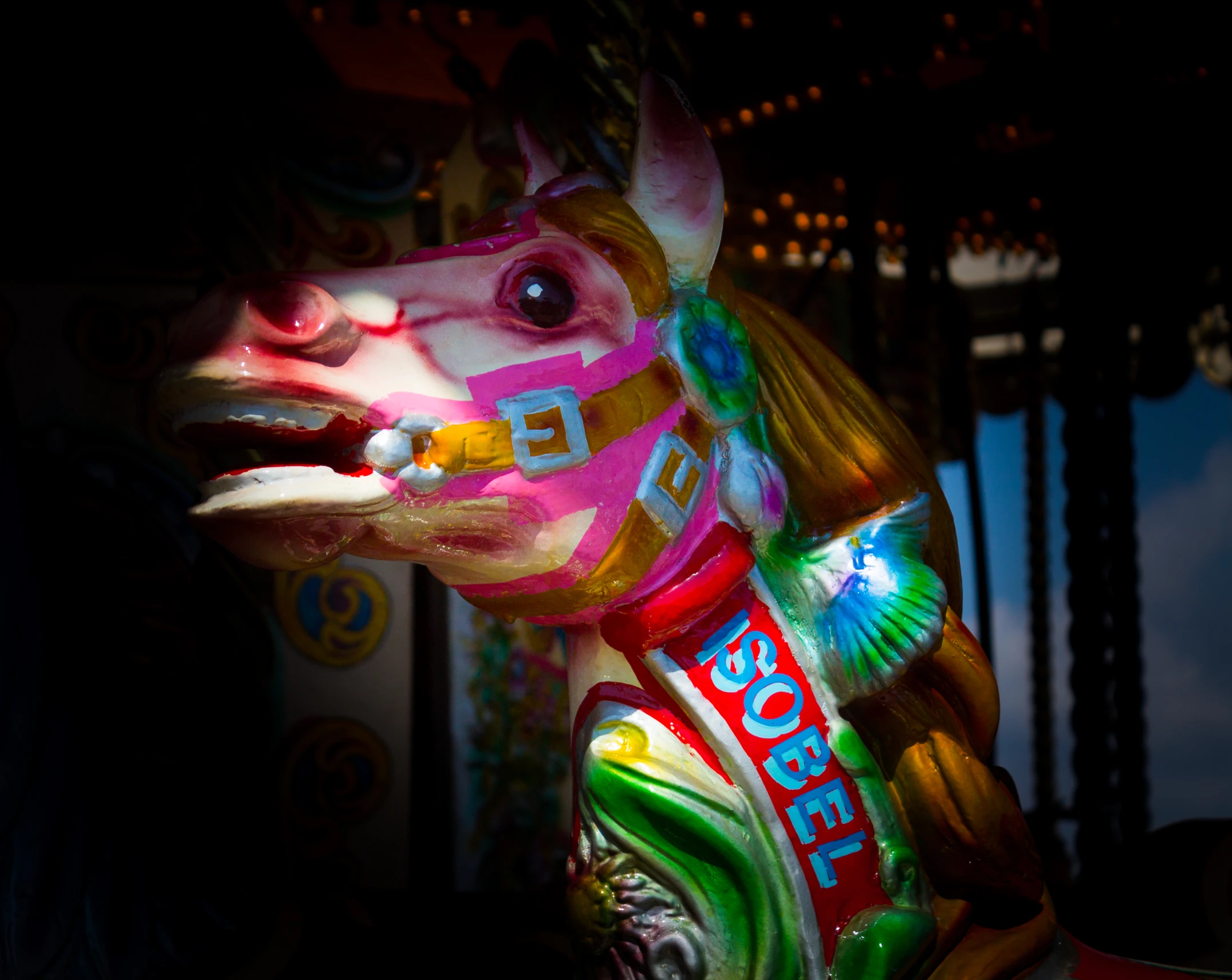 this is a brightly colored horse carousel ride