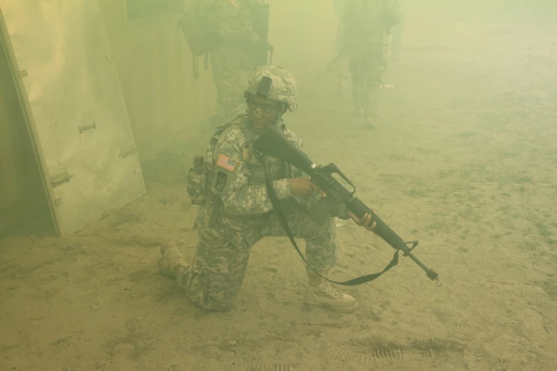 two soldiers are using their gun to fire