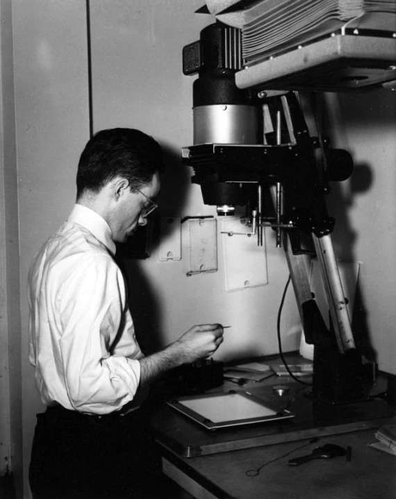 a man working in front of a machine