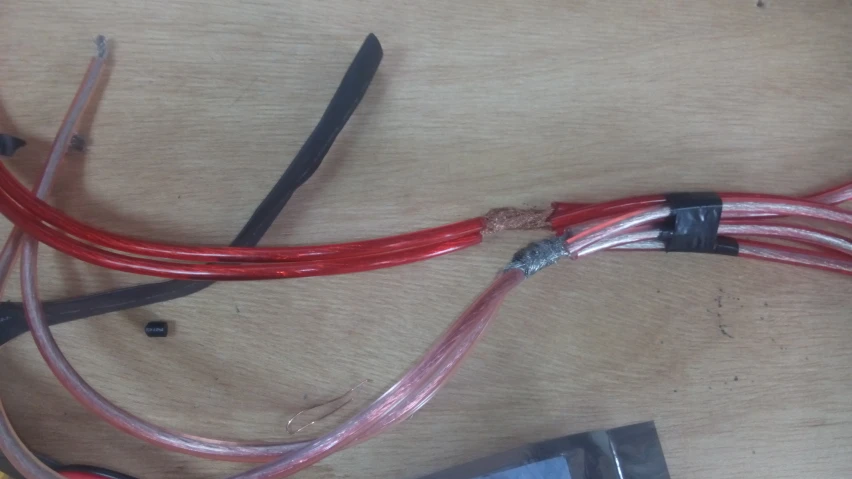 the red cord has been attached to a power cord