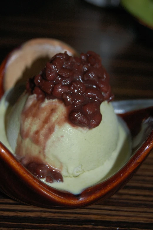 the dessert is presented in a brown bowl