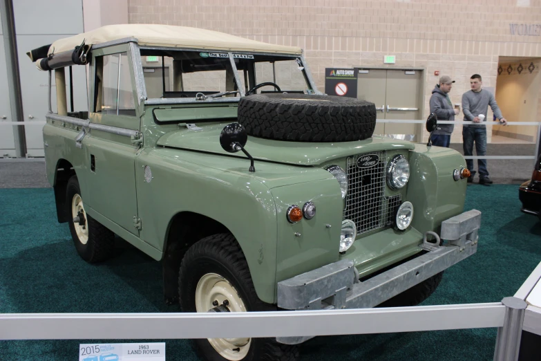 a large old army jeep in a museum display