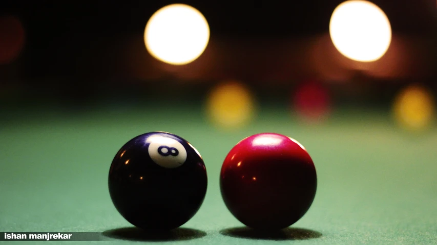 an image of two billiard balls that are close together