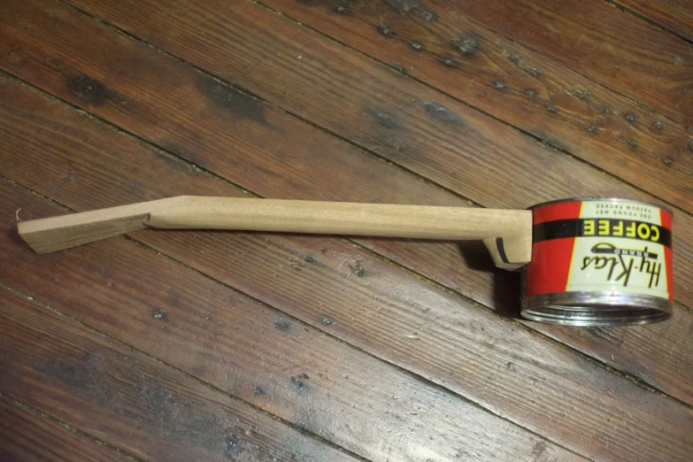 a hammer sits on top of a wooden table