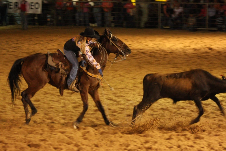 an image of a cowboy falling from a horse