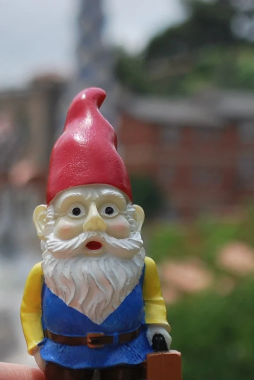 a close up image of an gnome holding a toy