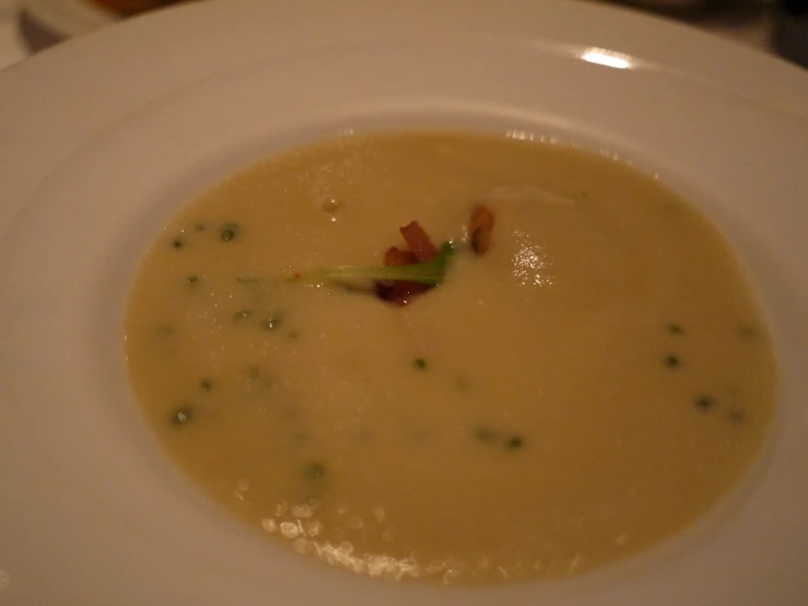 a soup bowl that is sitting on a table