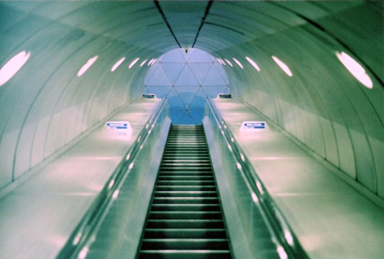 an escalator is seen in this artistic picture